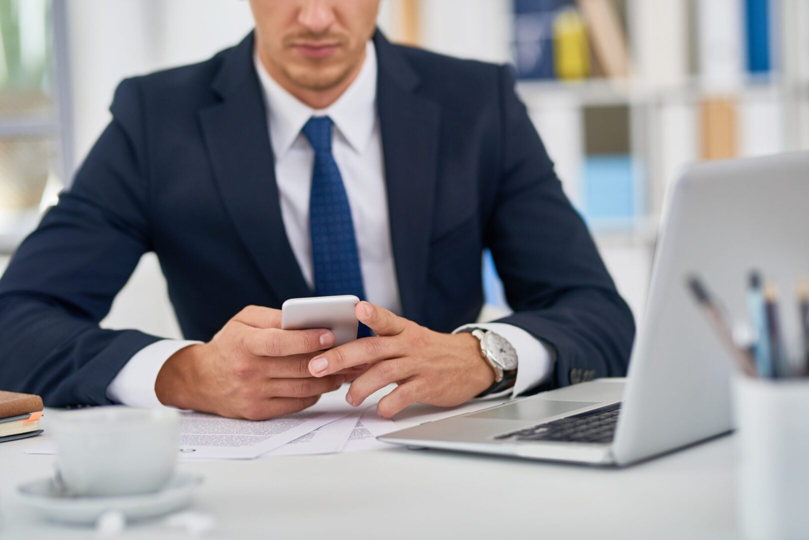 business-person-with-smartphone-2021-09-24-03-57-32-utc-scaled-1