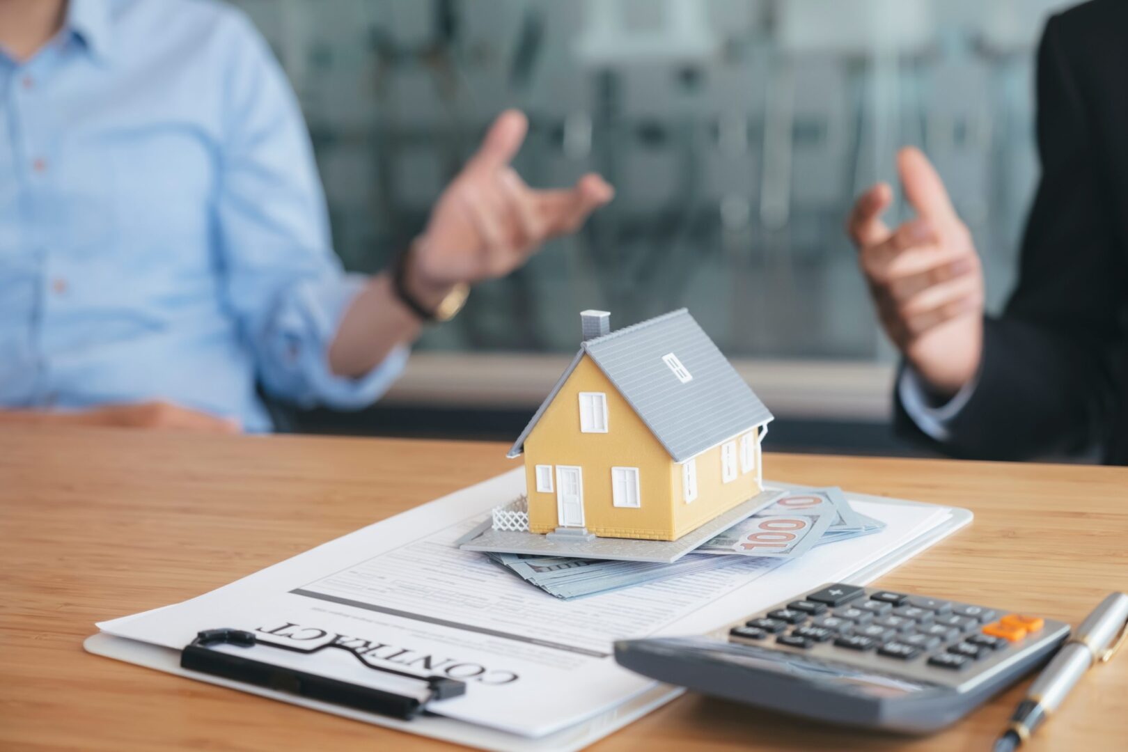 house-model-with-money-on-table-in-office-of-real-2022-08-01-03-19-19-utc-scaled-1