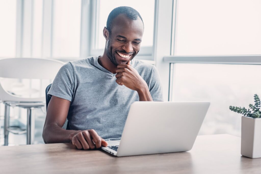 young-businessman-working-on-his-laptop-in-spaciou-2021-12-09-19-34-12-utc-scaled-1